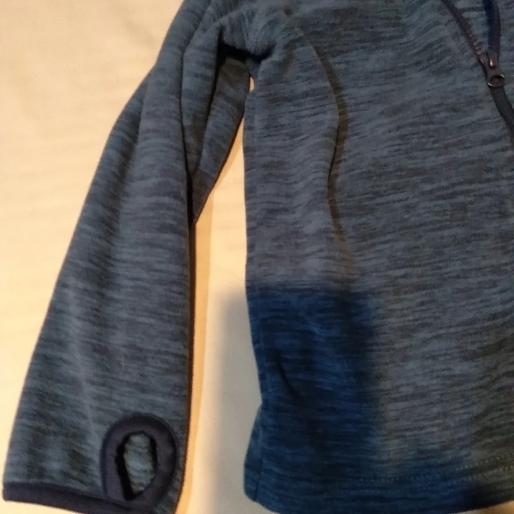 JUMPING bean brand Girls zip up thumb hole jacket. Blue print. Size Medi…